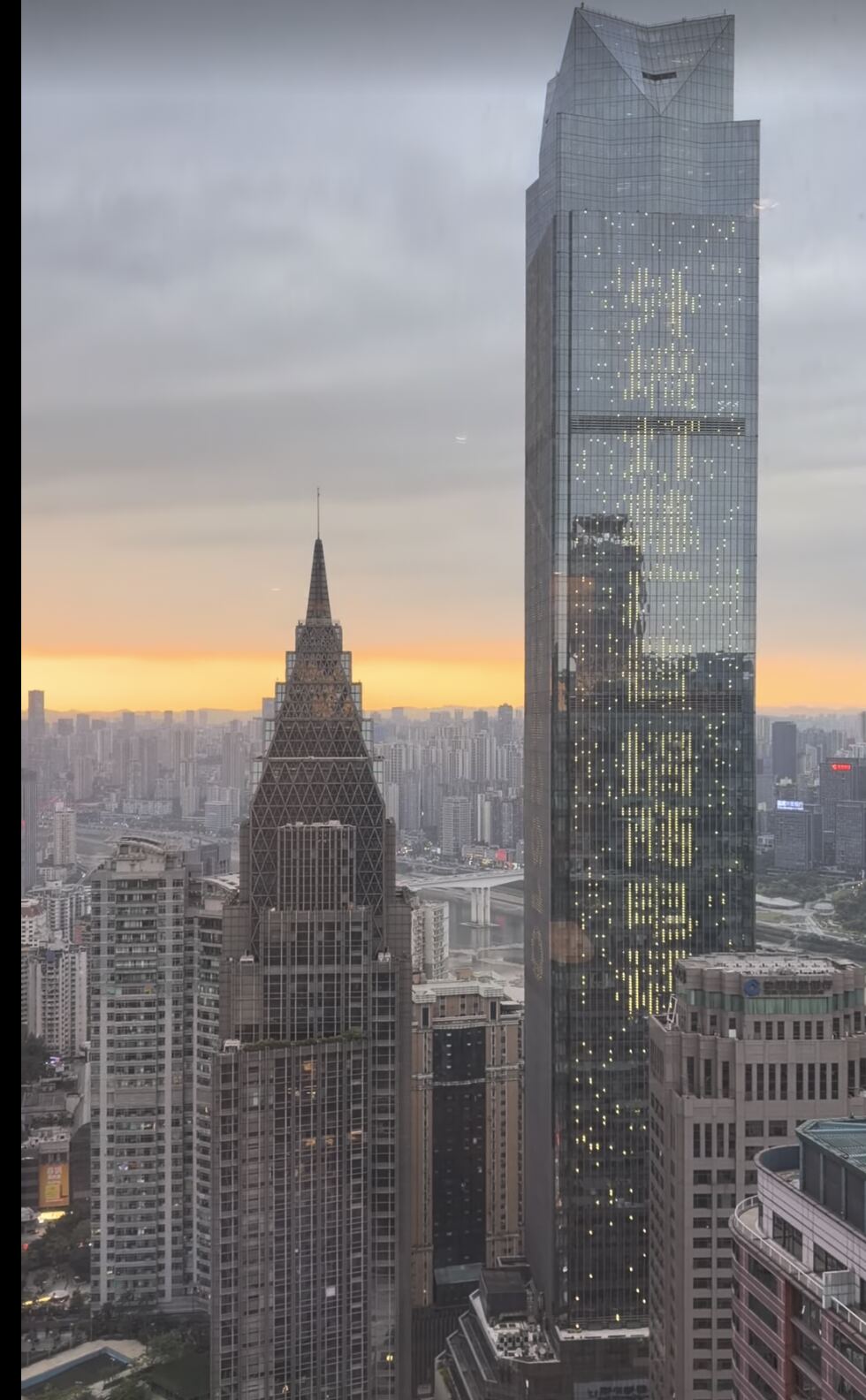 Skyscrapers and sunset skyline seen from a room at The Westin Chongqing Liberation Square