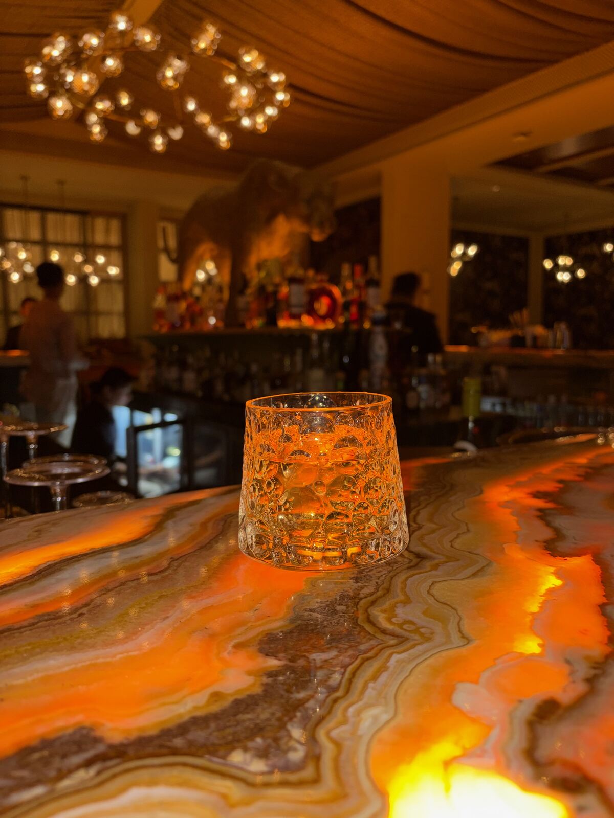Cocktail on the onyx bar counter at Dahaad, Fairmont Udaipur Palace