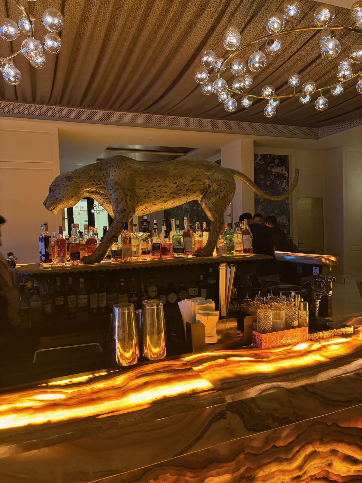 Life-sized panther statue above the bar shelf at Dahaad, Fairmont Udaipur Palace
