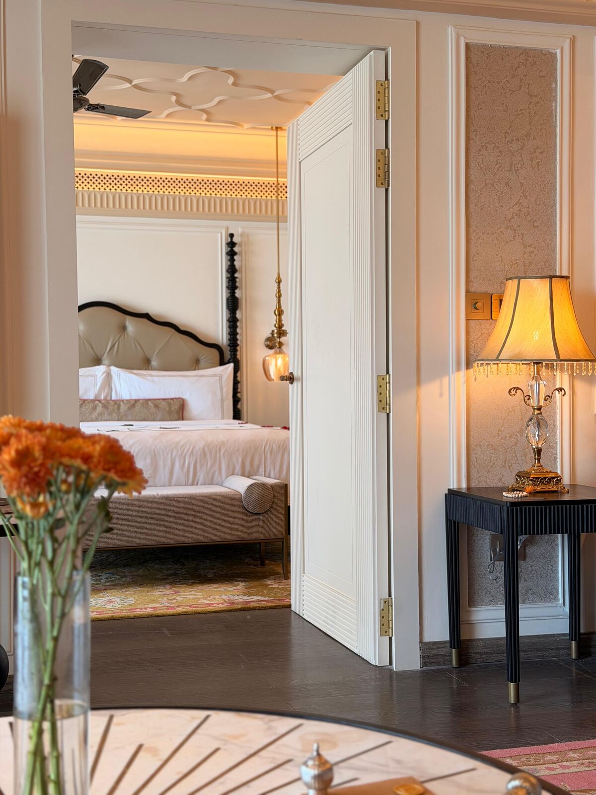 View into the bedroom of the Deluxe Suite at Fairmont Udaipur Palace