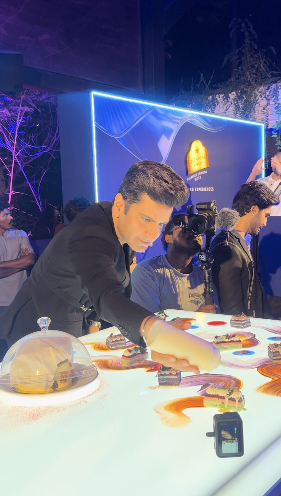 Chef Kunal Kapur plating dessert on an interactive table at Blenders Pride Reserved Experiences, Hyderabad
