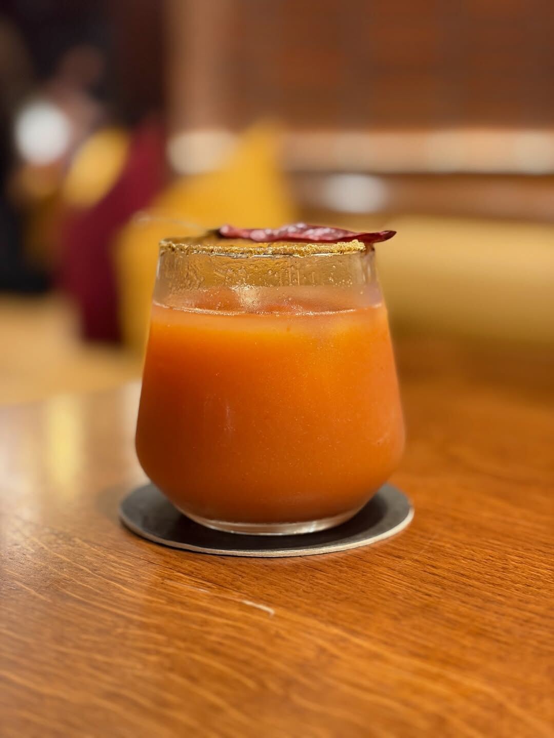 Spiced craft cocktail at Oota Hyderabad with chilli rim garnish — Telangana inspired bar menu