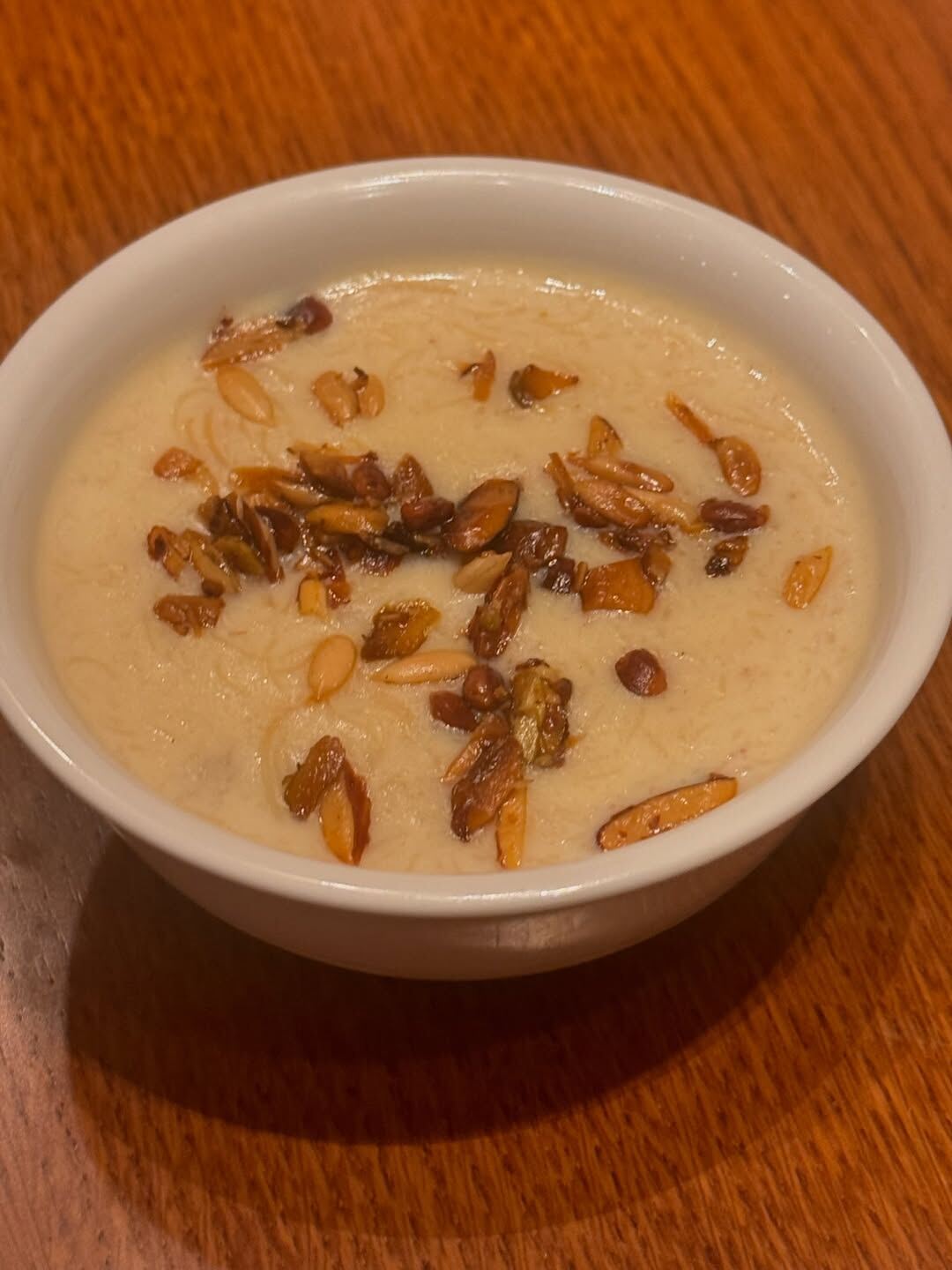 Sheer Khurma dessert at Oota Hyderabad garnished with nuts — Hyderabadi sweets