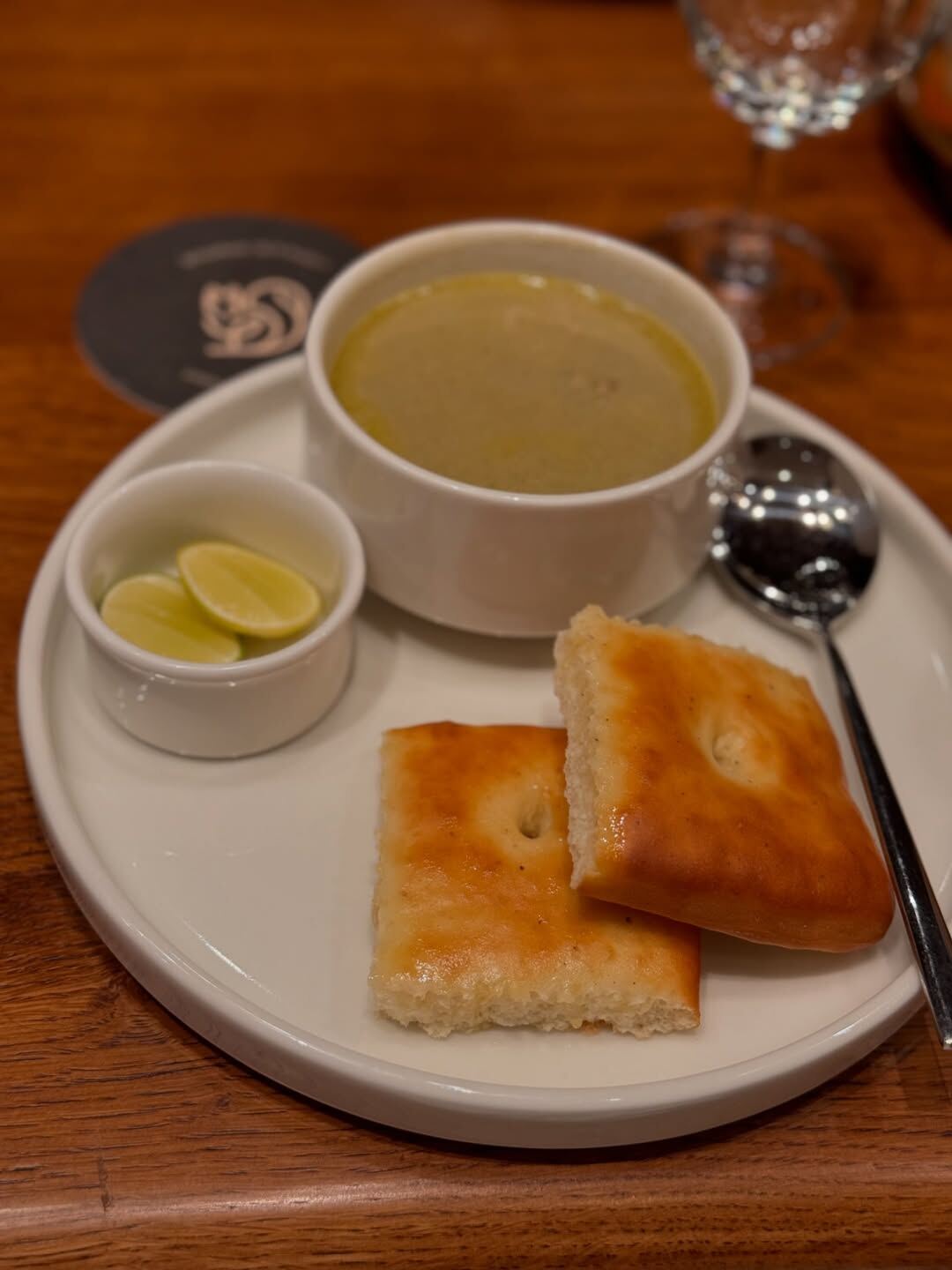 Marag mutton soup at Oota Hyderabad served with lime coriander and fried onion — Telangana cuisine