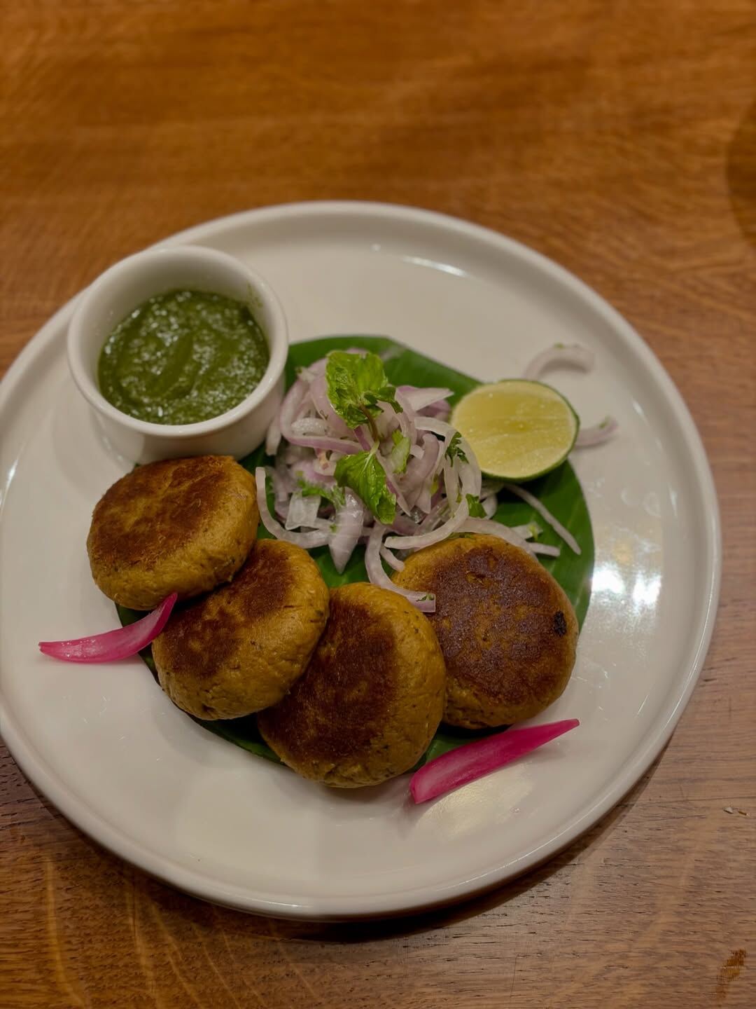 Shikampuri Kebabs at Oota Hyderabad with onion salad and lime — Telangana starter