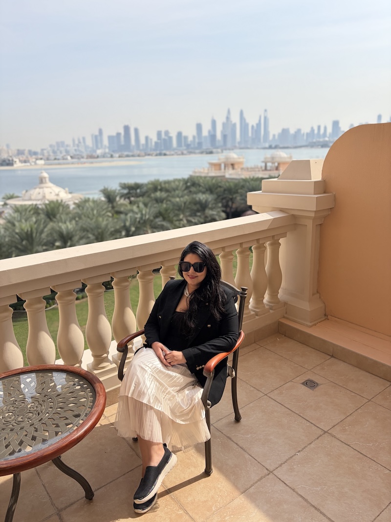 Relaxing on the spacious balcony of the Premier Suite at Raffles The Palm Dubai