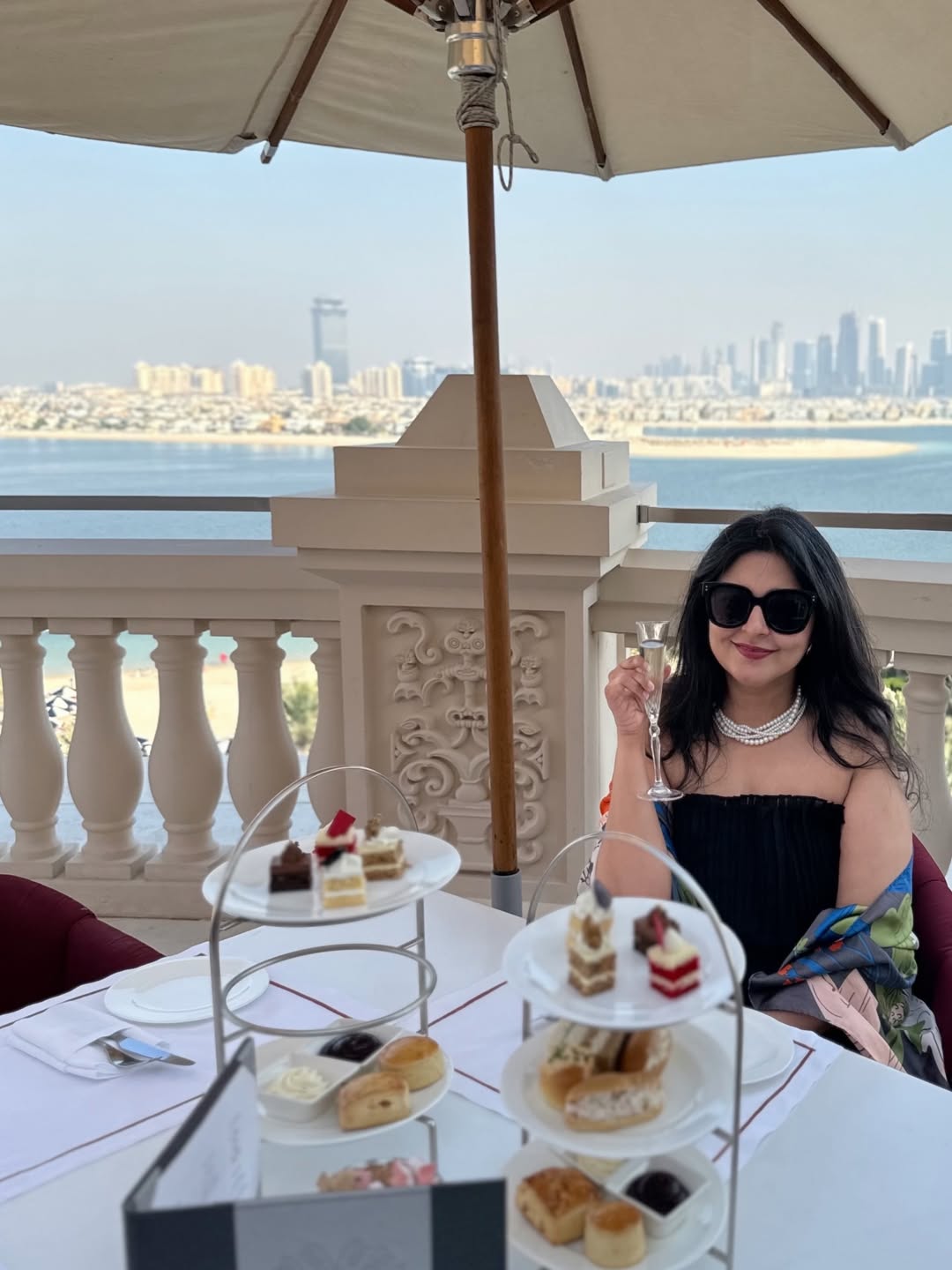 Raffles The Palm Dubai club lounge afternoon high tea with Dubai skyline views - Accor Platinum benefits luxury travel influencer Hyderabad