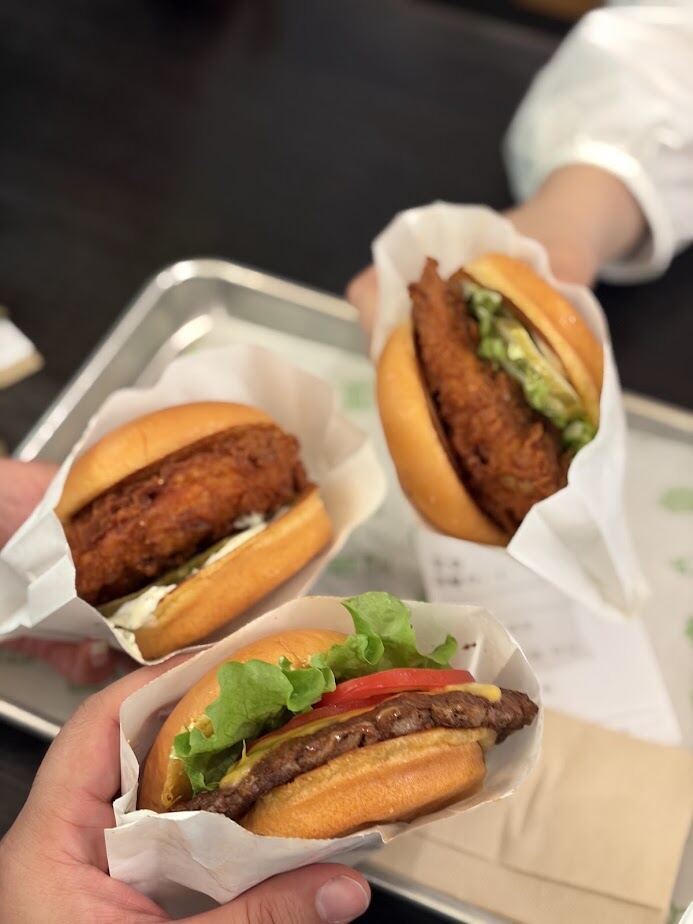 Shake Shack burgers held up at a Shanghai outlet after a day out with our Shanghai Greeter