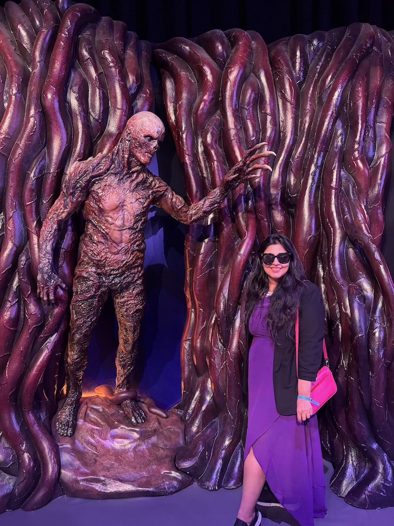 Reema at Stranger Things Experience Yas Island posing with Vecna character from the show
